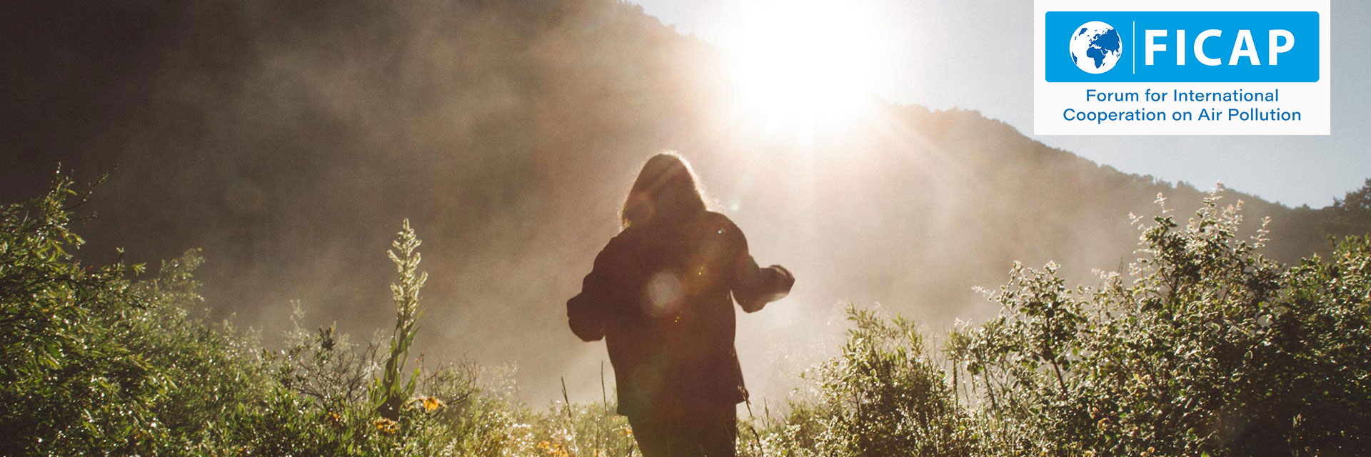 Silhouette of a person walking in the mountains.